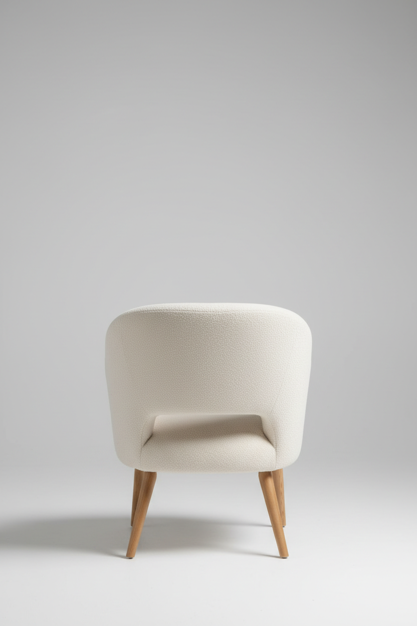 Back view of cream bouclé accent chair with curved backrest and wooden legs